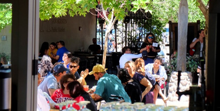 People enjoying the patio at El Mercado
